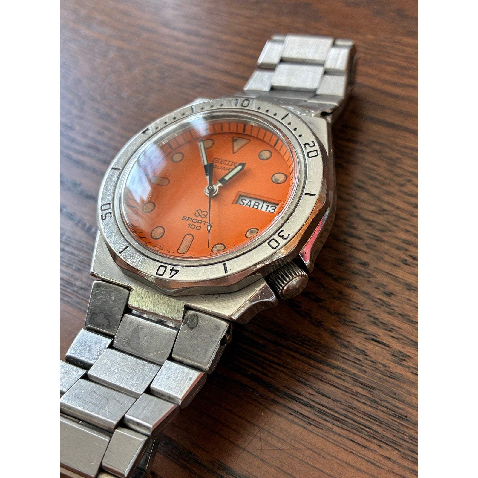 Vintage Seiko SQ Sports 100 Orange Dial Day Date- Bold Retro Style