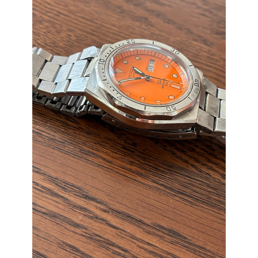 Vintage Seiko SQ Sports 100 Orange Dial Day Date- Bold Retro Style
