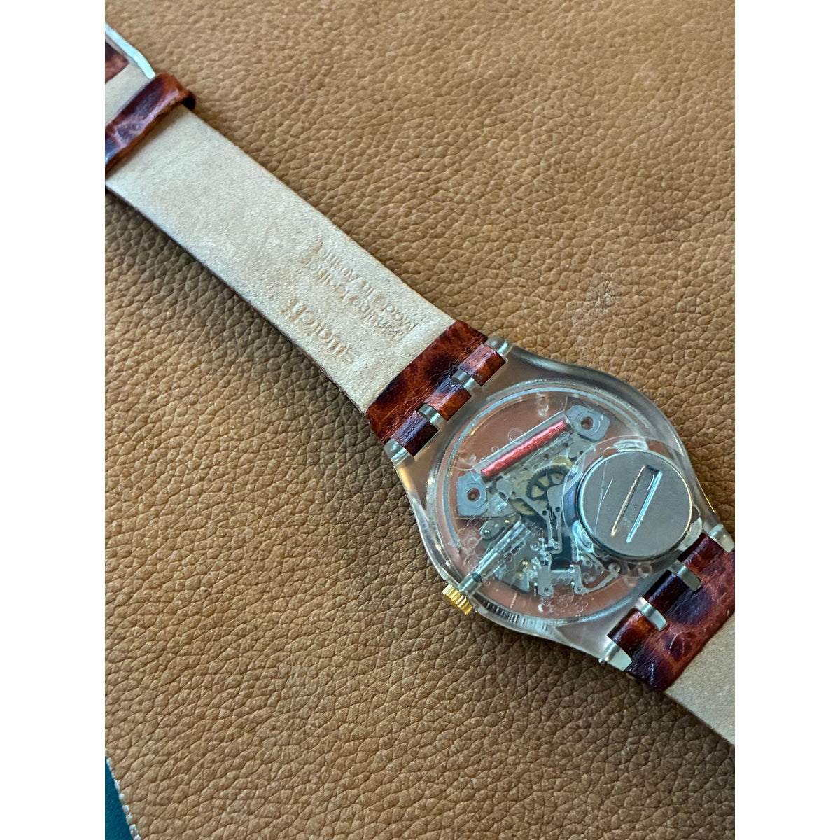 Vintage Swatch Swiss Quartz Watch Gold Tone Black Orange Dial Skeleton Back