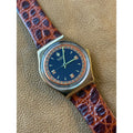 Vintage Swatch Swiss Quartz Watch Gold Tone Black Orange Dial Skeleton Back