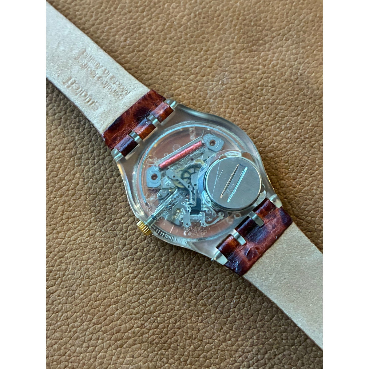 Vintage Swatch Swiss Quartz Watch Gold Tone Black Orange Dial Skeleton Back